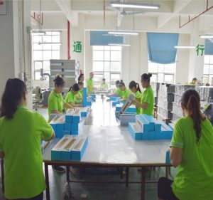Workers assembling high-end gift boxes by hand | Hug Packaging